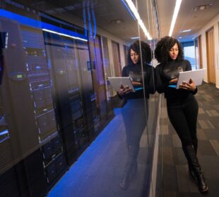 woman in black top using Surface laptop