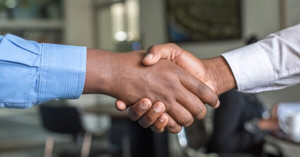 two people shaking hands