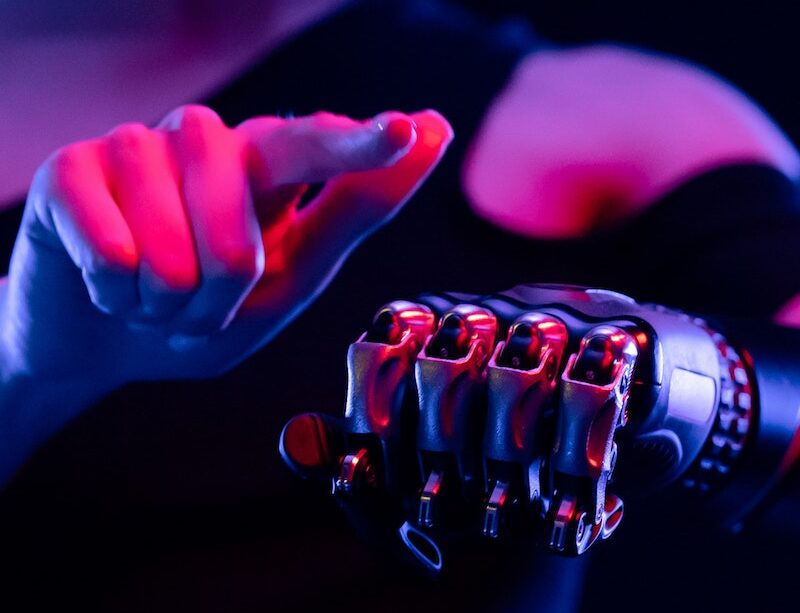 Woman Pointing Finger on Bionic Hand